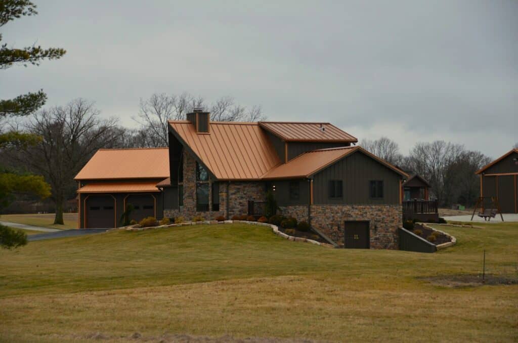 a large house with a brown roof and a brown roof